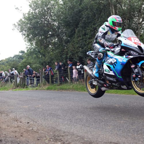 PACEMAKER, BELFAST, 25/7/2025: Michael Sweeney (MJR BMW) leaps Lagge Jumps ahead eventual Race of Legends at Armoy road race winner, Mike Browne (BPE Russell Racing Honda).
Picture by Stephen Davison