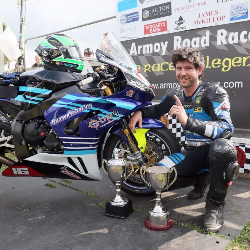 PACEMAKER, BELFAST, 25/7/2025: Mike Browne (BPE/Russell Racing Honda) celebrates winning the Race of Legends at Armoy road races with his team.
Picture by Stephen Davison